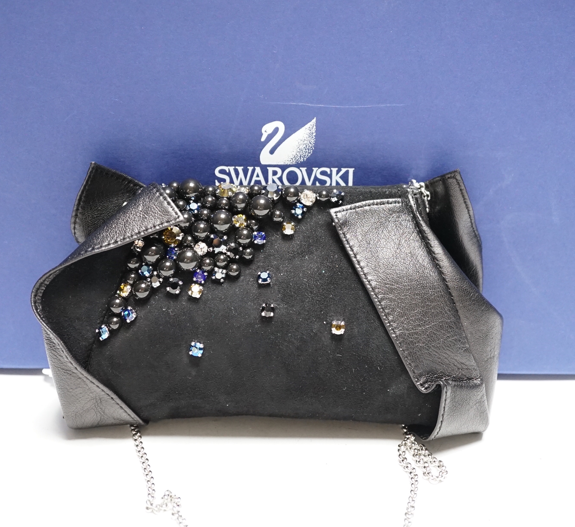 A Swarovski diamanté decorated black suede and leather evening bag, with chain handle, dust bag, box and cover